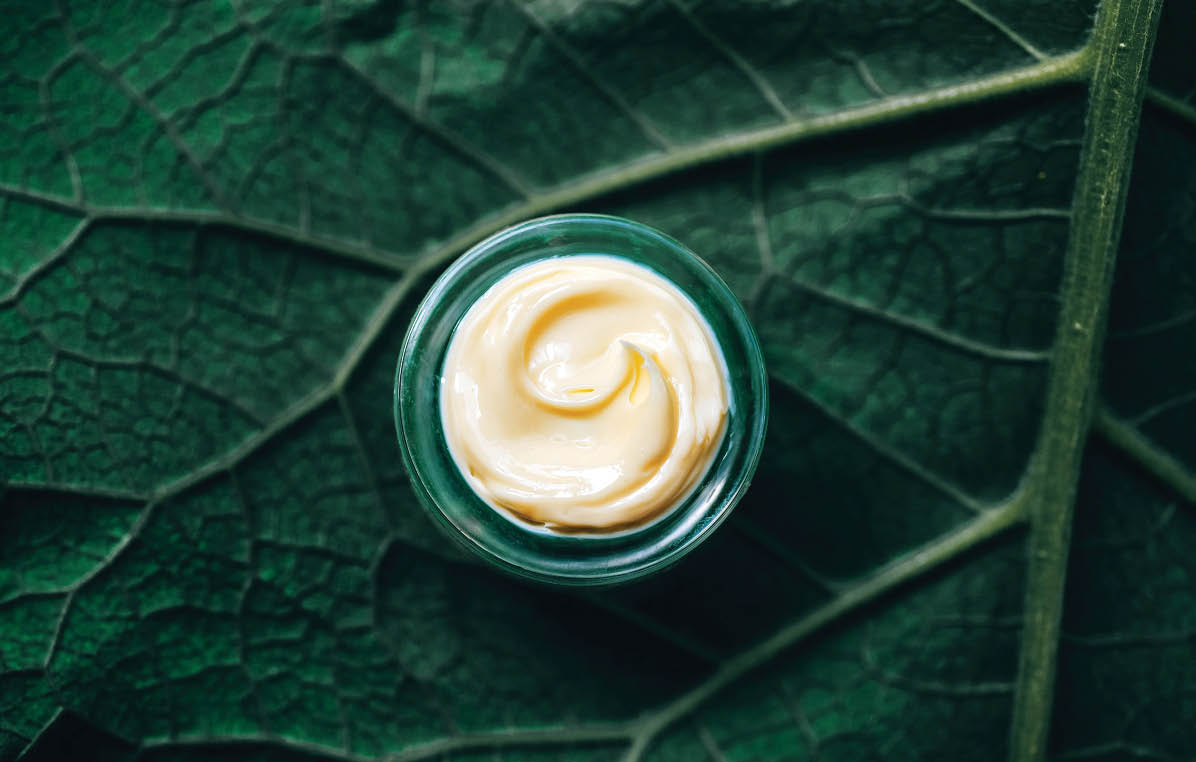 Texture of natural cosmetic cream for body care on a green leaf  Natural organic cosmetics from plants for skin care; Shutterstock ID 1748911514; purchase_order: B+S Cosmetics; job: Press Release InCosmetics; client: ABU; other: 
