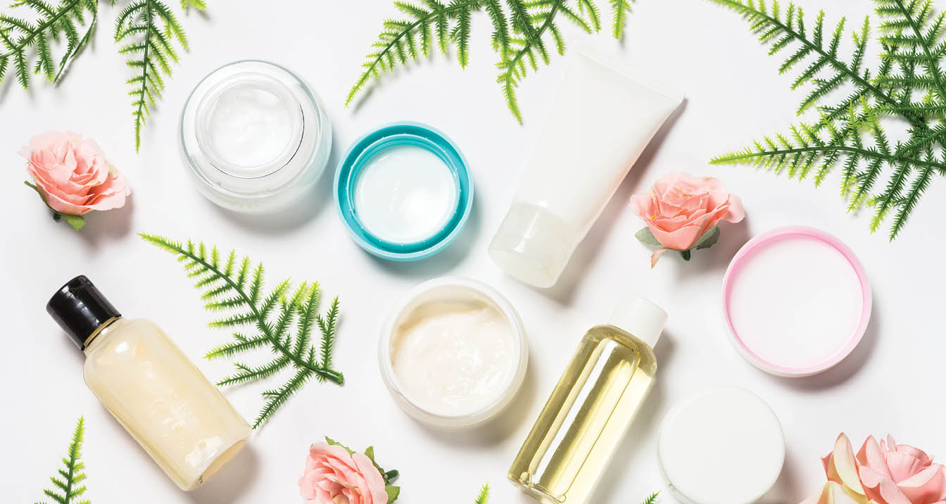 Facial cosmetics, Skin care product, natural cosmetic with green fern leaves and roses  Flat lay image on white 