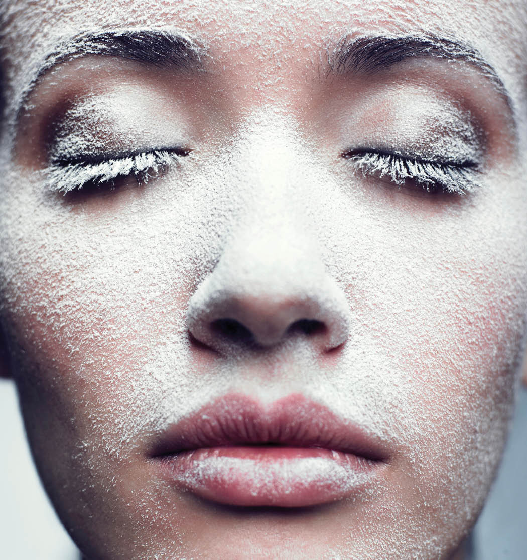 Portrait of beautiful girl with frost on face