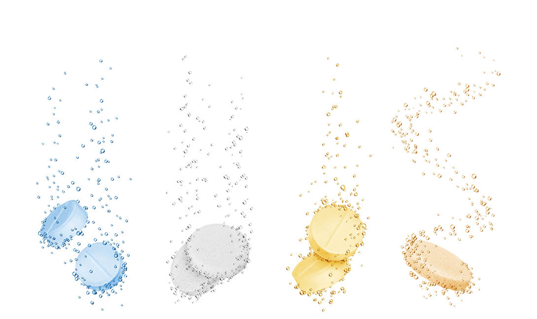 Set of water-soluble pills close-up on white background