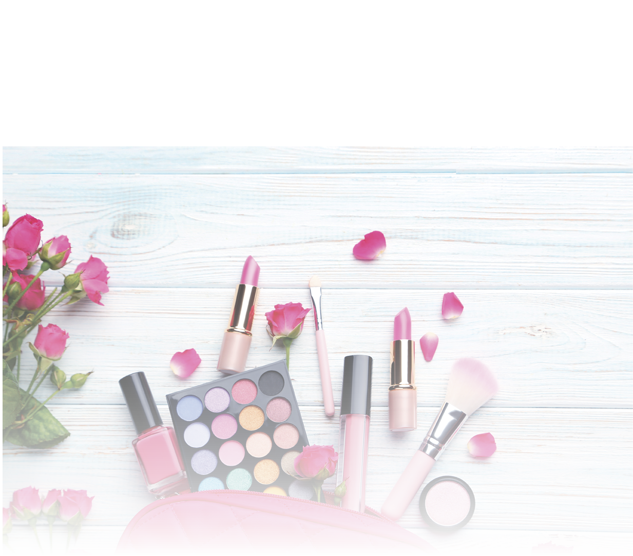 Different makeup cosmetics on white wooden table