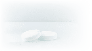 Effervescent tablet dissolved in a glass of water