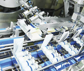  pharmaceutical industry. Line machine conveyer for packaging glass bottles ampoules in boxes at factory 