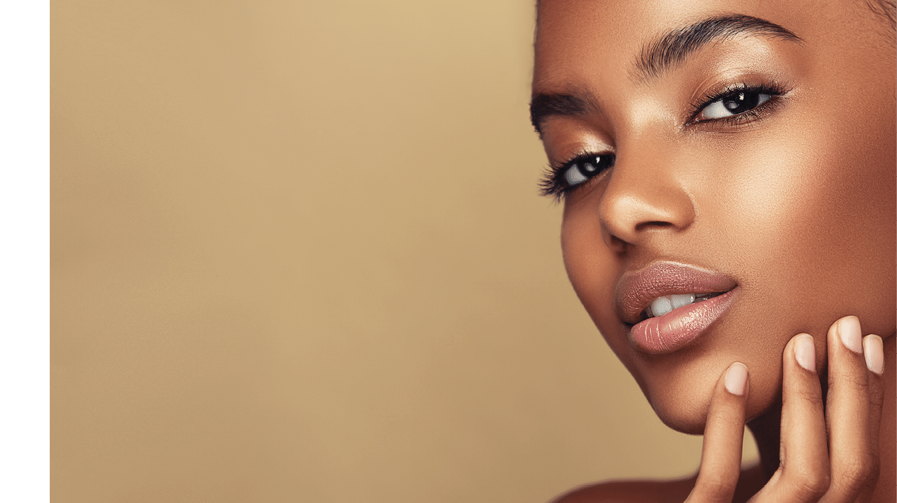 Beauty portrait of African American girl . Beautiful black woman touch her face . Facial treatment . Cosmetology , skin care  and spa . 