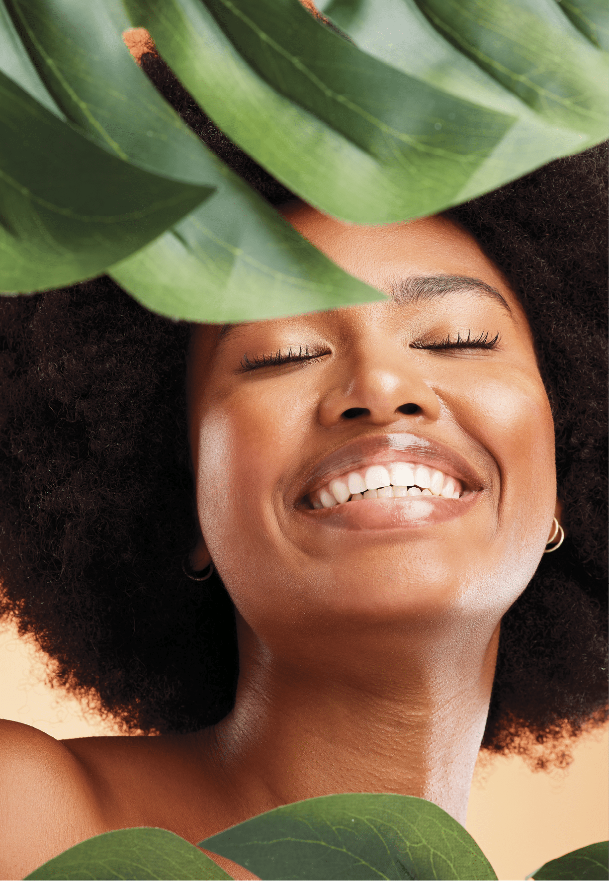 Aloe vera plant, skincare and black woman for beauty glow, face health and wellness in studio mock up marketing or advertising. Model smile with natural hair growth or dermatology product promotion