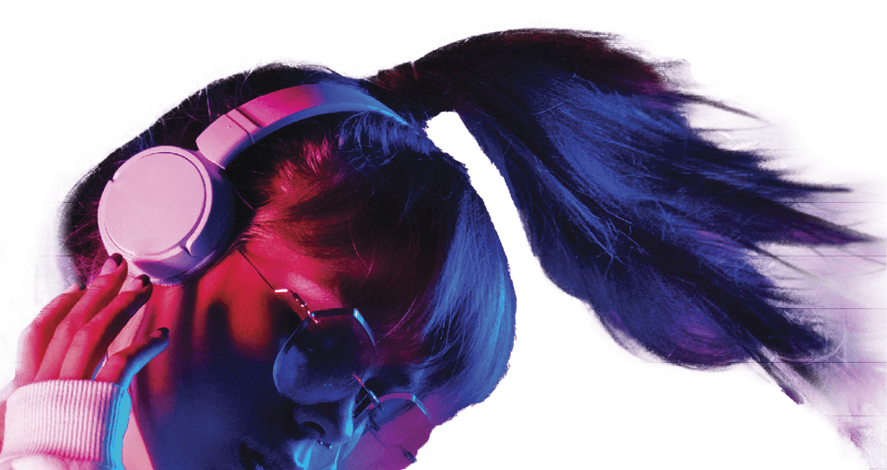 Stylish fashion teenager model wearing hoodie and headphones listening dj music dancing in purple neon lights. Young teen girl enjoy cool music 90s party mix in violet studio background. Copy space.
