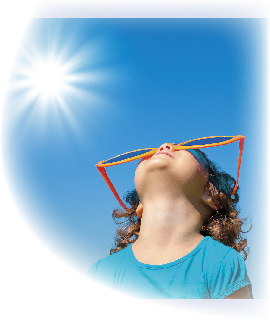 Happy little girl with big sunglasses looking at the sky with sun in summer