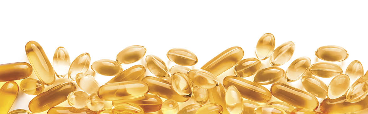 Fish oil capsules on white background
