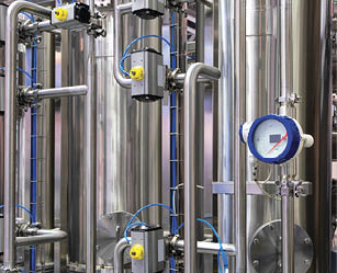 Machine for industrial pharmaceutical production of medicines close-up, industrial pharmaceutical production concept background