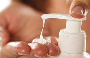 putting pomade on hand from the pump