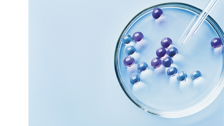 Lab dropper with sample of gel bubbles in petri dish on blue background, hard shadows. Abstract science, medicine and beauty concept