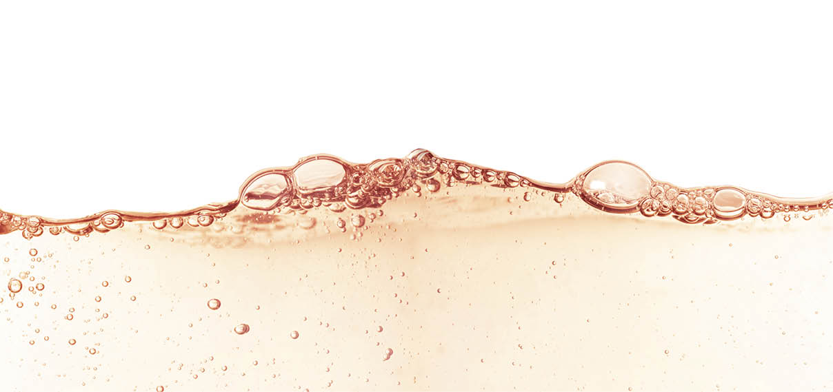 Splash of cosmetic moisturizer floral water micellar toner lotion or emulsion abstract background