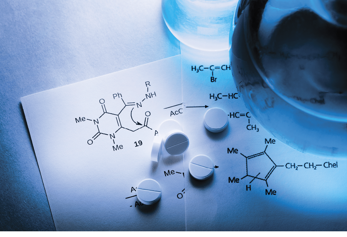 Chemistry reaction formula with white pills in closeup
