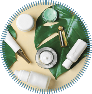 Natural cosmetics and leaves on light background