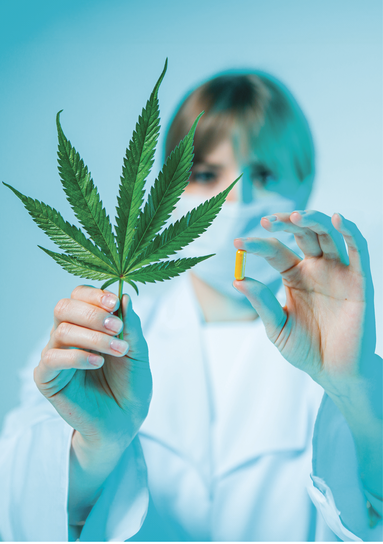 Female doctor with hemp pill and cannabis leaf in hands in studio. Organic dietary supplements